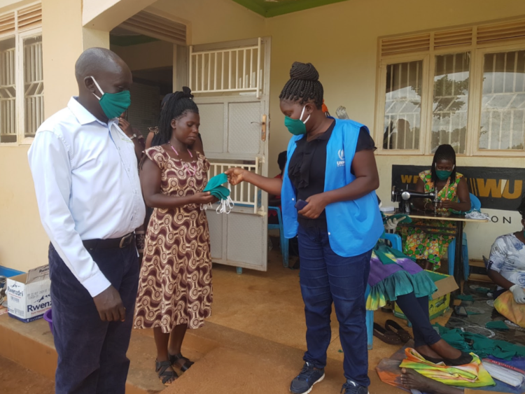 WPDI and UNHCR hand out masks in the Kiryandongo Refugee Settlement in Uganda