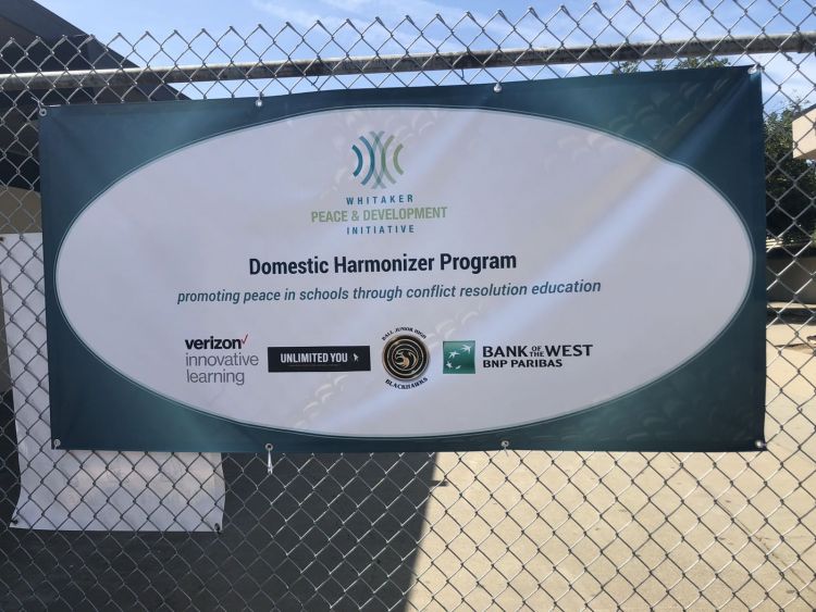 A banner supporting WPDI's Domestic Harmonizer Program