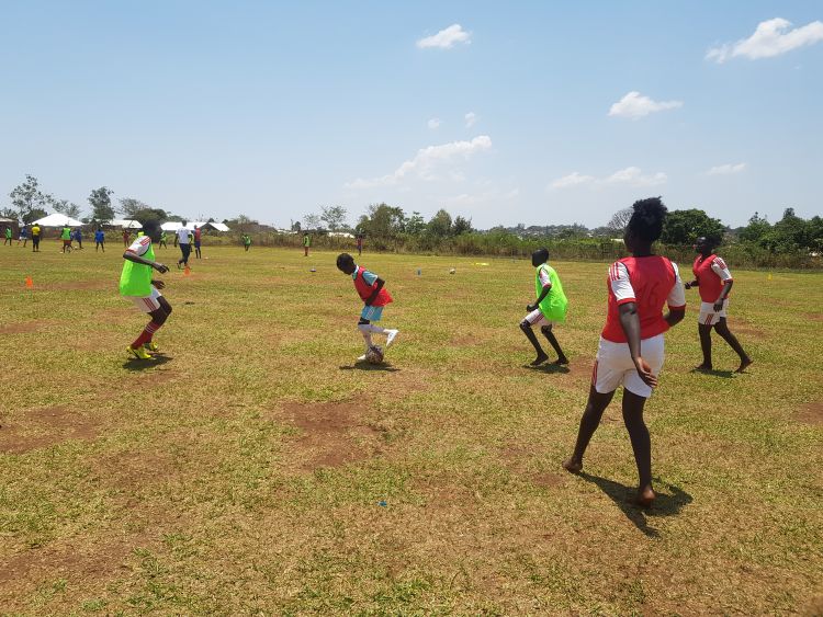 Youth playing soccer in WPDI's Peace Through Sports program