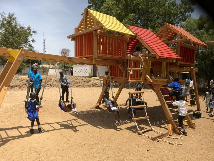 Children playing on the new playground