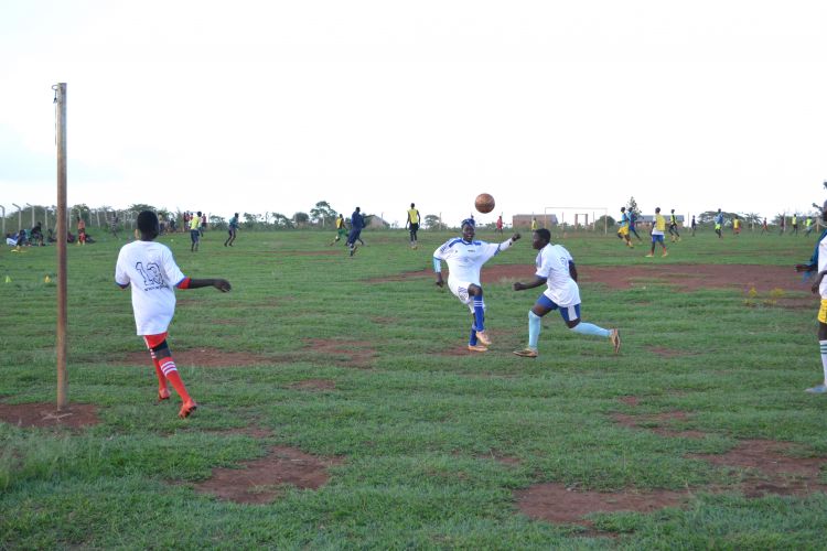 Youth playing soccer in the Whitaker Peace Cup