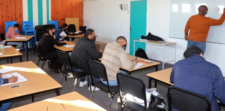 Youth learning about business and entrepreneurship taught by WPDI